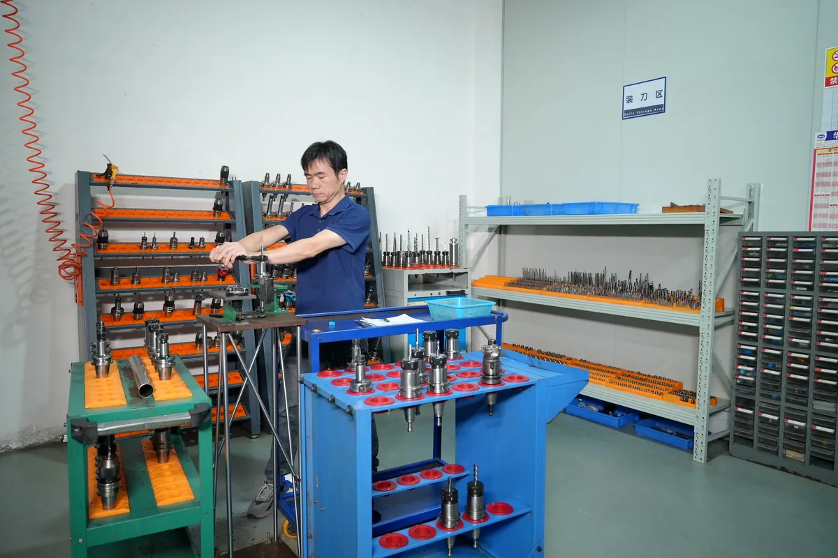 TaiMachining organized tooling and component preparation area